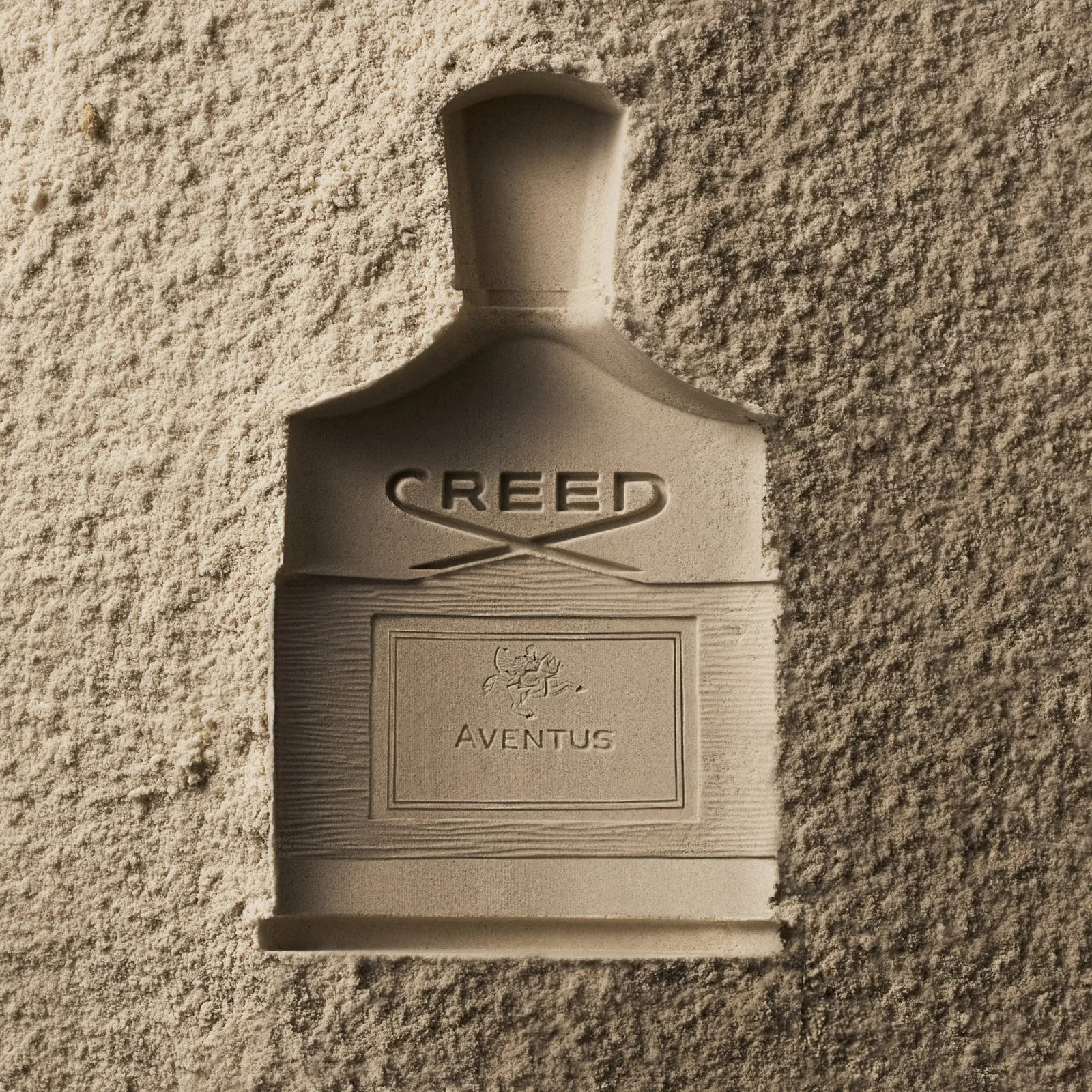 No bottle at all — only its absence pressed into powdered stone like a fossil: the Creed script, the horseman seal, the word Aventus in bas-relief