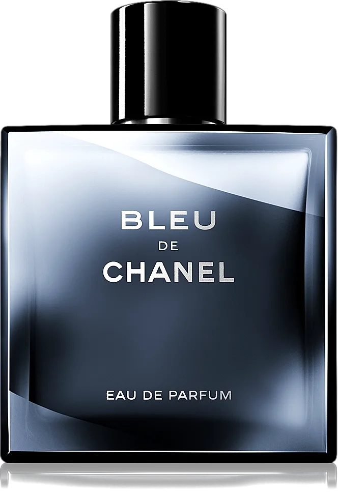 The bevelled slab of midnight-blue glass stands square to the light, its silver-stamped name floating over a depth that shades from smoke to ink, the black cap heavy as a full stop