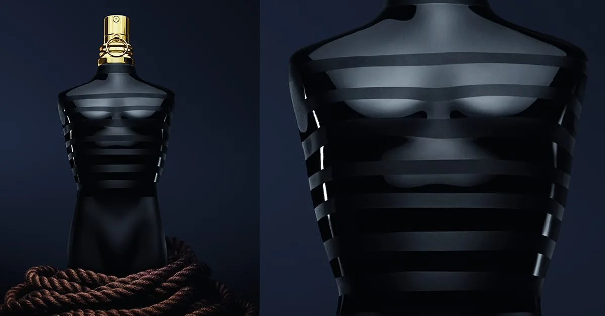 Twin portraits on midnight navy: the black flacon rises from a coil of rope, gold atomizer gleaming, beside a macro study of its lacquered marinière stripes